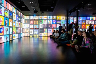 Understanding the Invisible exhibition at MEET Milan - visitors experiencing immersive NFT data visualization