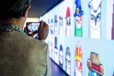 Understanding the Invisible exhibition at MEET Milan - visitors experiencing immersive NFT data visualization