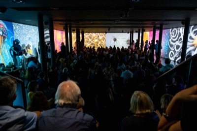 Understanding the Invisible exhibition at MEET Milan - visitors experiencing immersive NFT data visualization